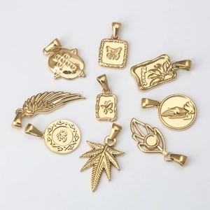 Golden stainless steel pendants featuring cross, butterfly, and wing shapes for DIY jewelry