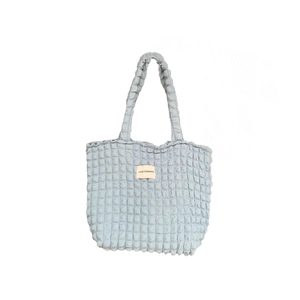 Borsa tote celeste con trama a bolle trapuntata e manici minimalisti per donna