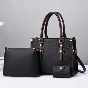 Three-piece black crocodile pattern tote bag set with matching clutch and small wallet