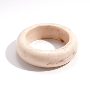 Minimalist beige resin bangle featuring retro brown marble patterns and a thick round design