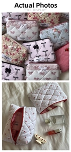 Macro view of quilted cotton cosmetic bag with floral patterns and red checkered lining