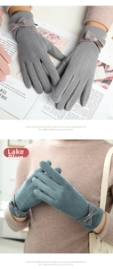 Detail of warm thermal gloves featuring elegant bow decoration and touchscreen capability