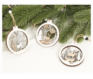 Macro detail of hollow wooden Christmas ornaments with reindeer and snowflake patterns