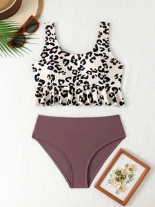 Flat lay of leopard print ruffled bikini top with rose purple high-waisted bottoms