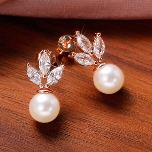 Elegant rose gold earrings with marquise-cut zircon leaves and hanging round pearls