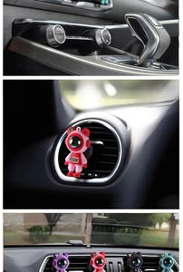 Detailed view of astronaut car air vent clips in multiple colors for interior decoration