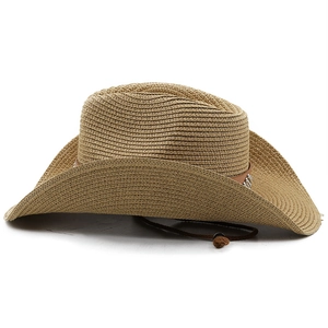 Detail of straw cowboy hat with woven texture, decorative metal studs and chin strap