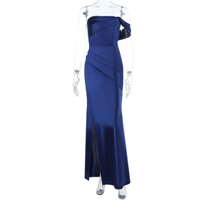 Detail of high-slit satin evening dress showing the pleated texture and fabric sheen