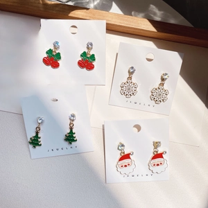 Christmas earrings set with Santa, elk, and snowflake designs in festive colors