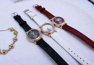 Three fashion quartz watches with rhinestone bezels and starry dials on leather straps