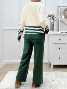 Detail of knitted long-sleeve top and trousers with green stripe patterns back view