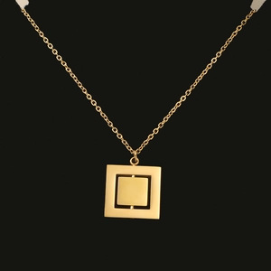 Detail view of double-layer rotating geometric square pendant necklace in gold-plated steel
