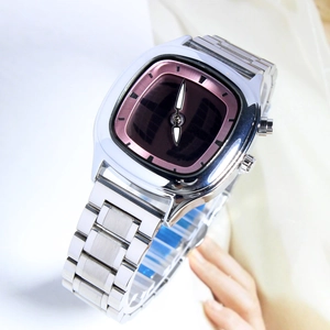 Close-up of a retro men's quartz watch with a square dial and silver alloy band