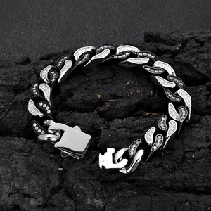 Macro shot of 12mm silver stainless steel Cuban link bracelet with micro-pave crystals