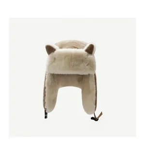Detail of plush animal ears and soft faux fur lining on khaki winter trapper hat