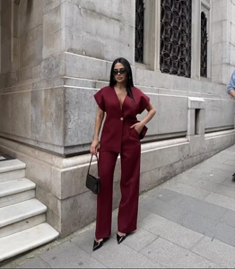 Deep burgundy two-piece set featuring a single-button blazer and high-waisted wide-leg trousers
