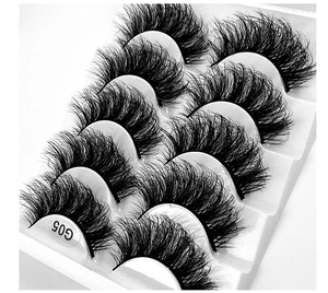 Close-up of 5 pairs of thick curly black false eyelashes in fan shape model G05