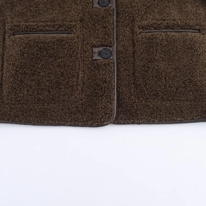 Women's dark brown faux shearling jacket with leather piping and button closure
