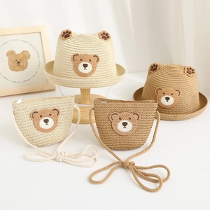 Detailed view of kids woven straw hat and mini bag set with cute 3D bear ears