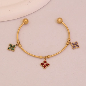 Elegant gold open bangle with colorful clover charms in red, green and purple