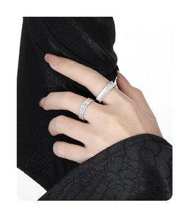 Detail of S925 sterling silver rings with frosted texture and woven mesh design for women