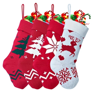 Set of 4 red and white knitted Christmas stockings with reindeer and snowflake patterns