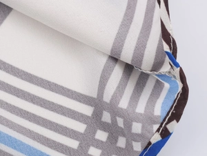 Detailed macro shot of geometric plaid fabric with high-quality hem stitching