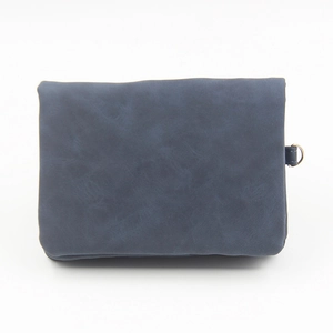 Vintage navy blue matte leather folding wallet with D-ring detail on white background