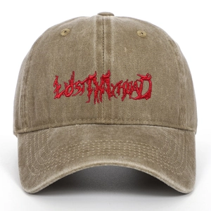 Detailed macro shot of vintage red 3D embroidery text on washed cotton baseball cap