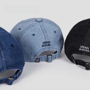 Rear view of denim baseball caps in three colors showing metal buckle and embroidery