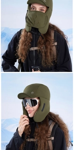Detail of army green thermal trapper hat with adjustable mask for winter hiking