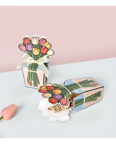 Detail of 3D tulip gift boxes with silk ribbons and colorful floral illustrations