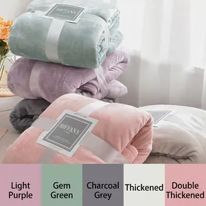 Thick coral fleece blanket in various colors like grey and purple for winter warmth