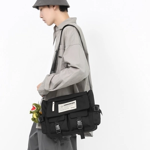 Japanese retro black messenger bag with large capacity and green dinosaur charm