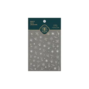 Elegant snowflake and butterfly nail stickers in white and gold finish for nail art