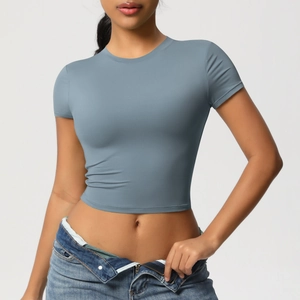 Close-up of gray-blue tight-fit quick-dry yoga crop top featuring high-stretch knit fabric