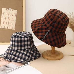 Foldable plaid fisherman bucket hat for women in brown and navy checkered patterns