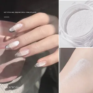 Iridescent aurora nail powder in jar with moonstone chrome finish and hand application
