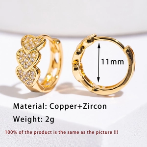 Detailed close-up of 11mm triple heart micro-pave zircon gold-plated hoop earrings