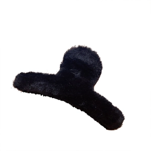 Elegant large black plush claw clip for hair with soft faux fur texture for women