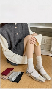 Detail showing various colors of combed cotton socks with ribbed texture for women