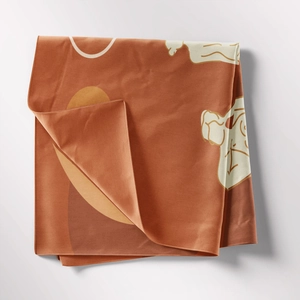 Detail of terracotta Bohemian tapestry with abstract geometric lines and fine woven texture