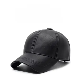 Detail of classic black leather baseball cap showing multi-row stitching on the curved brim