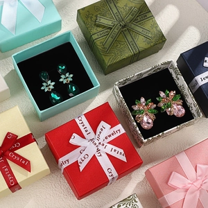 Premium jewelry gift boxes with bows in multiple colors including red, blue and pink