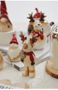Detailed view of ceramic Christmas reindeer with glitter glaze and warm holiday aesthetic