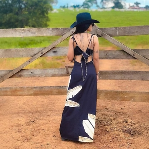 Elegant black floral print backless maxi dress with stylish lace-up design and sun hat
