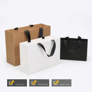 Three premium paper gift bags in black, white, and brown with durable woven handles