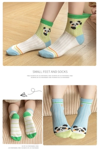 Detail of mesh cotton kids socks with panda pattern and breathable vertical texture