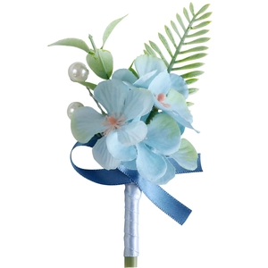 Light blue hydrangea boutonniere with green leaves and white pearls for wedding suit