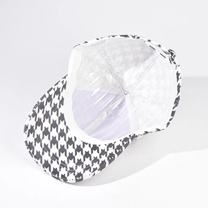 Detail view of houndstooth baseball cap interior showing quality lining and care label